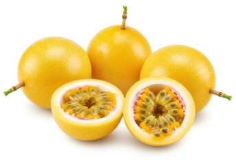 A group of yellow passion fruits with one cut in half showing seeds on a white background view