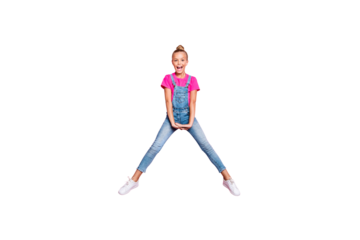 Full length body size photo of cute nice jumping girl doing splits wearing fuchsia t-shirt screaming overjoyed isolated over pink color pastel background