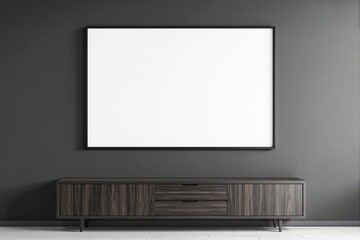 Blank white frame mockup on dark wall above wooden cabinet.