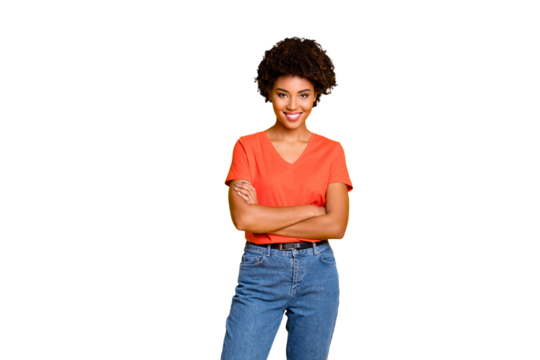 Photo of cheerful nice cute charming fascinating attractive girlfriend standing confidently with hands folded wearing jeans denim isolated with yellow vivid color background