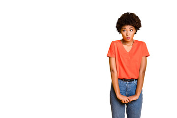 Fototapeta premium Copyspace photo of cute charming pretty girlfriend unconfident standing hesitating to ask something wearing jeans denim isolated over yellow vivid color background
