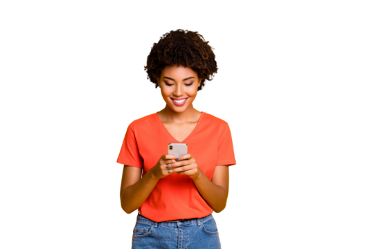 Photo of cheerful trendy attractive cute youngster browsing through her social media profiles in search of new information in feednews wearing jeans denim t-shirt isolated vivid color background