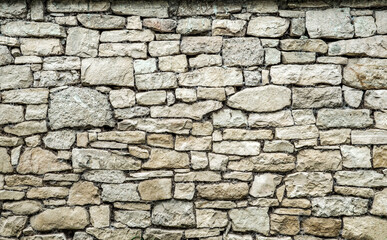 Fototapeta premium front view od wall in grey natural stones textured ans forming a background