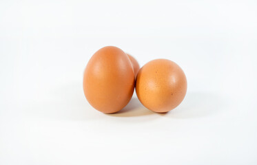 front view of  brown chicken eggs is isolated on white background with clipping path.Suitable for editing and used for food and nutrition advertising.