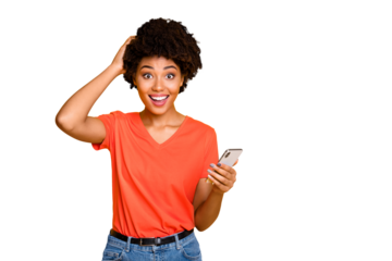 Photo of cheerful funny crazy charming pretty sweet student influencing people via social media receiving feedback excited of this wearing jeans denim ornage t-shirt isolated vivid color background