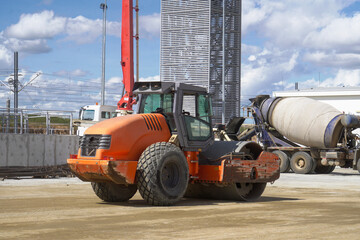 Roller Machine Compacting Soil at Construction Site