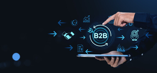 Business B2B concept with icons and tablet on dark background interface screen.