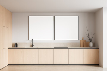 Modern kitchen interior with two blank square posters on wall above minimalist countertop and cabinetry for design mockup display purposes. 3D Rendering