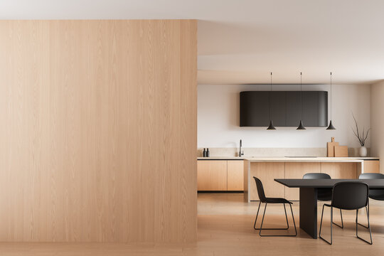 Modern kitchen interior with light wood blank wall and stylish dining area for creative design mockup or poster template display concept. 3D Rendering