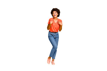 Full length body size photo of cheerful curly wavy black lady wearing jeans denim unable to believe in being chosen excited rejoicing isolated over yellow vivid color background