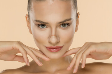 Front headshot showcasing professional makeup application with seamless foundation and contour...