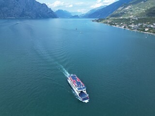 Fototapeta premium Boat with tourists on Lake Garda Italy. Drone view