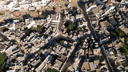 Fototapeta premium Snow-Covered Alberobello Trulli Village Aerial View Celebrating New Year Season