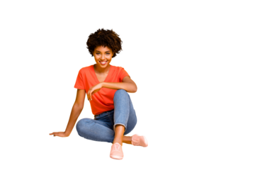 Portrait of positive charming cheerful girl sit have free time enjoy rest relax weekends wear casual style clothes sneakers isolated over yellow bright color background