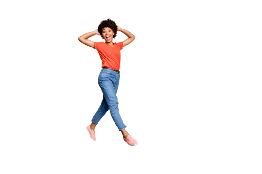 Full length photo of funny funky crazy girl have walk jump go feel cheerful have weekends free time in spring wear red stylish clothes sneakers isolated over yellow color background