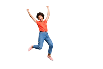 Full size photo of crazy funny funky girl jump raise her fists scream yeah celebrate victory lottery wear red t-shirt denim jeans sneakers isolated over yellow color background
