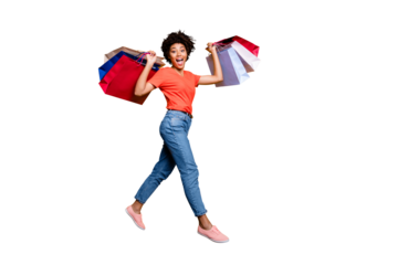  50% off! Full body photo of funky funny amazed wavy curly brown hair lady jump go walk hold bags from travel  weekends wear trendy red t-shirt denim jeans isolated yellow color background