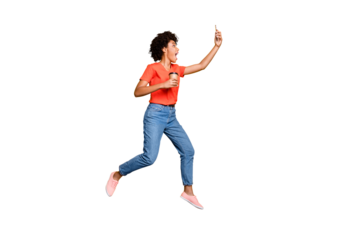 Full body profile side photo of crazy funny wavy hair beautiful girl use cellphone take selfie trip journey hold mug jump wear t-shirt jeans sneakers isolated over yellow color background