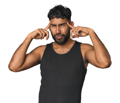 Young Hispanic man isolated focused on a task, keeping forefingers pointing head.