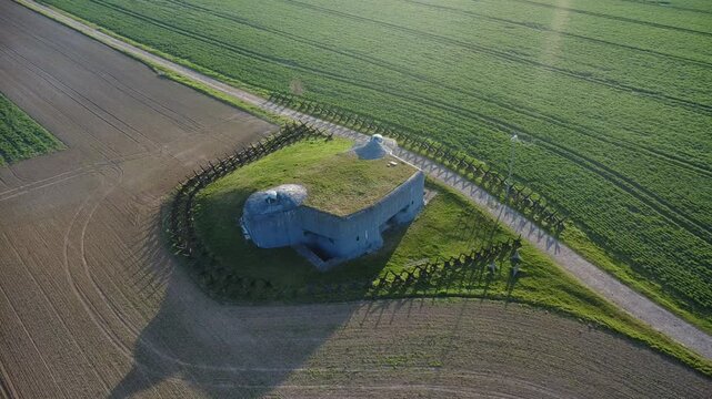 Aerial drone footage of the infantry bunker OP-S 25 near the town of Milostovice, Opava, in Northern Moravia, Czech Republic. Captured on a sunny spring morning, the video showcases the historical War