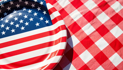 Fototapeta premium Patriotic paper plate with stars and stripes design on red checkered tablecloth for picnics, summer gatherings, outdoor events, and holiday celebrations