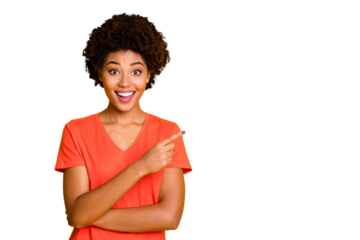 Photo of stylish cute charming nice girlfriend pointing at sales and discounts with her forefinger smiling toothily with excited facial expression isolated over yellow vivid color background