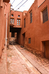 narrow street in the old town, narrow street in old Abyaneh, old alley, village road, clay alley, Quiet alley in a historic village, Ancient street in old Persian town