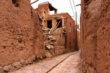 old abandoned house, old abandoned building, Ancient village, Peaceful alley, Village road, Abyaneh village, Narrow alley leading to a blue sky, Ancient village under a cloudy sky, Iran, Persia