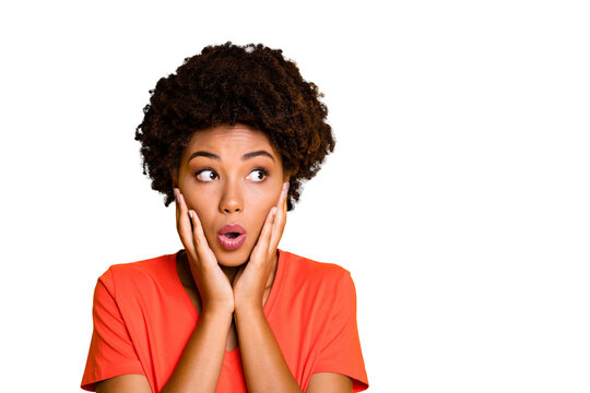 Photo of black afro american fearful girlfriend feeling guilty about something holding her cheeks with hands lips pouted isolated over yellow vibrant color background