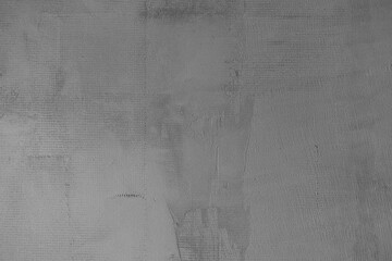 Gray textured wall with subtle abstract patterns and variations in tone