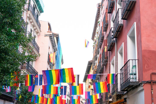 Rainbow flags hanging between buildings celebrating gay pride