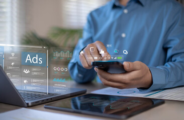 Digital marketing online sales concept. Businessman using laptop with advertising dashboard, promoting product or service through digital channels, search engines, email, website ads and social media.