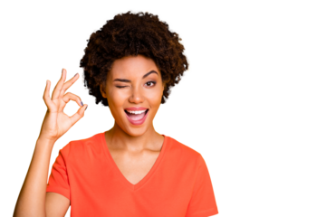 Copyspace photo of cheerful blinking curly wavy trendy woman showing you ok sign winking wearing orange t-shirt isolated over yellow bright color background
