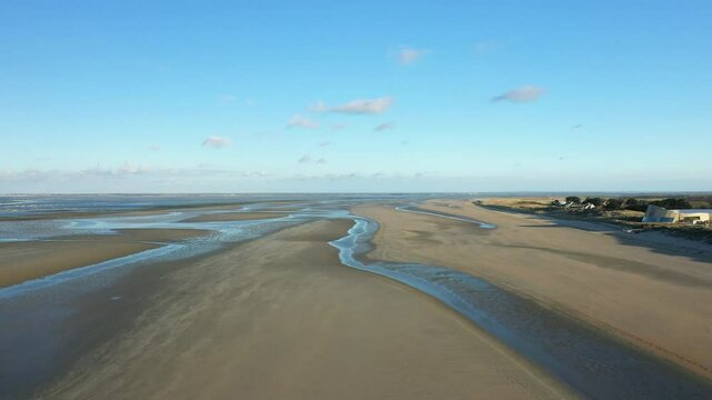 Utah Beach bordered by sand dunes in Europe, France, Normandy, near Carentan, in spring, on a sunny day.&nbsp;