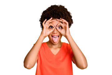 Photo of fooling cheerful funny cute nice attractive black girlfriend sticking her tongue out wearing orange t-shirt isolated over yellow vivid color background