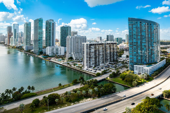 Miami, Florida - Feb 25, 2025: Aerial view of Edgewater waterfront high-rises in Miami, Florida, with scenic Biscayne Bay and modern residential towers.