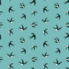 Stylized swallows on turquoise background. Vector bird seamless pattern design for kids fabric or wallpaper. 