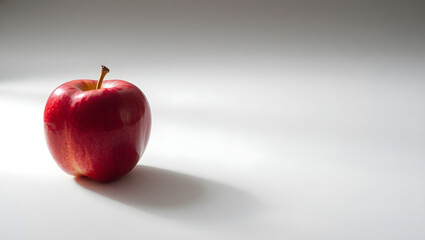 Solitary Red Apple A Study in Light and Shadow