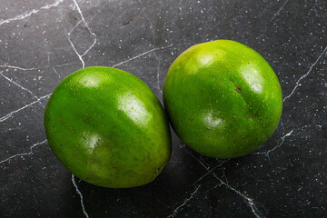 Two ripe green exotic avocado fruit