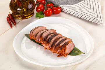 Sliced duck breast baked with cherry
