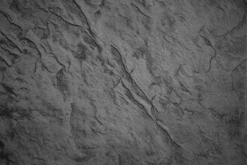 Textured gray surface with unique waves and patterns in natural lighting