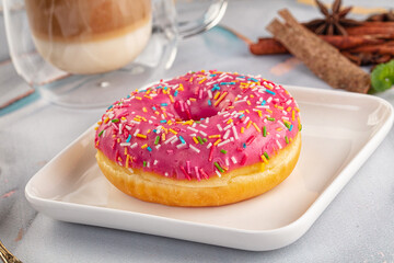 Sweet donut with strawberry icing