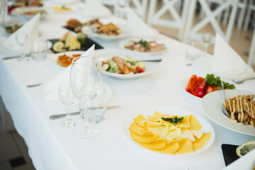Delicious array of food beautifully arranged on a long dining table at an event