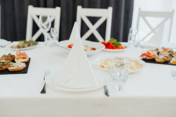 Set dining table with appetizers and drinks ready for a special event
