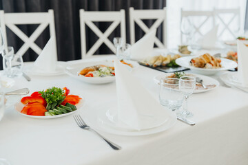 Elegant dining setup with assorted dishes and fresh veggies for an occasion
