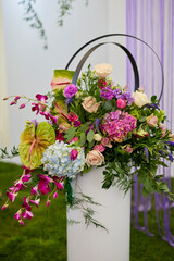 landscape with a floral arrangement of various roses