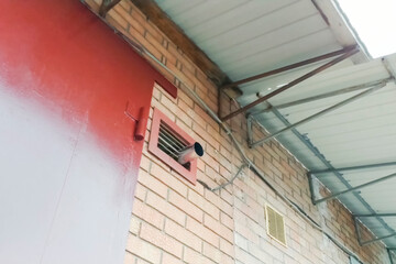 Ventilation grilles in brick wall