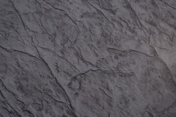 Detailed texture of weathered stone surface with distinct lines and patterns