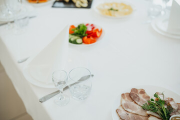 Elegant buffet with assorted dishes and fresh veggies in bright setting