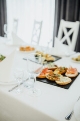 Elegant dining setup with appetizers on a table before a gathering